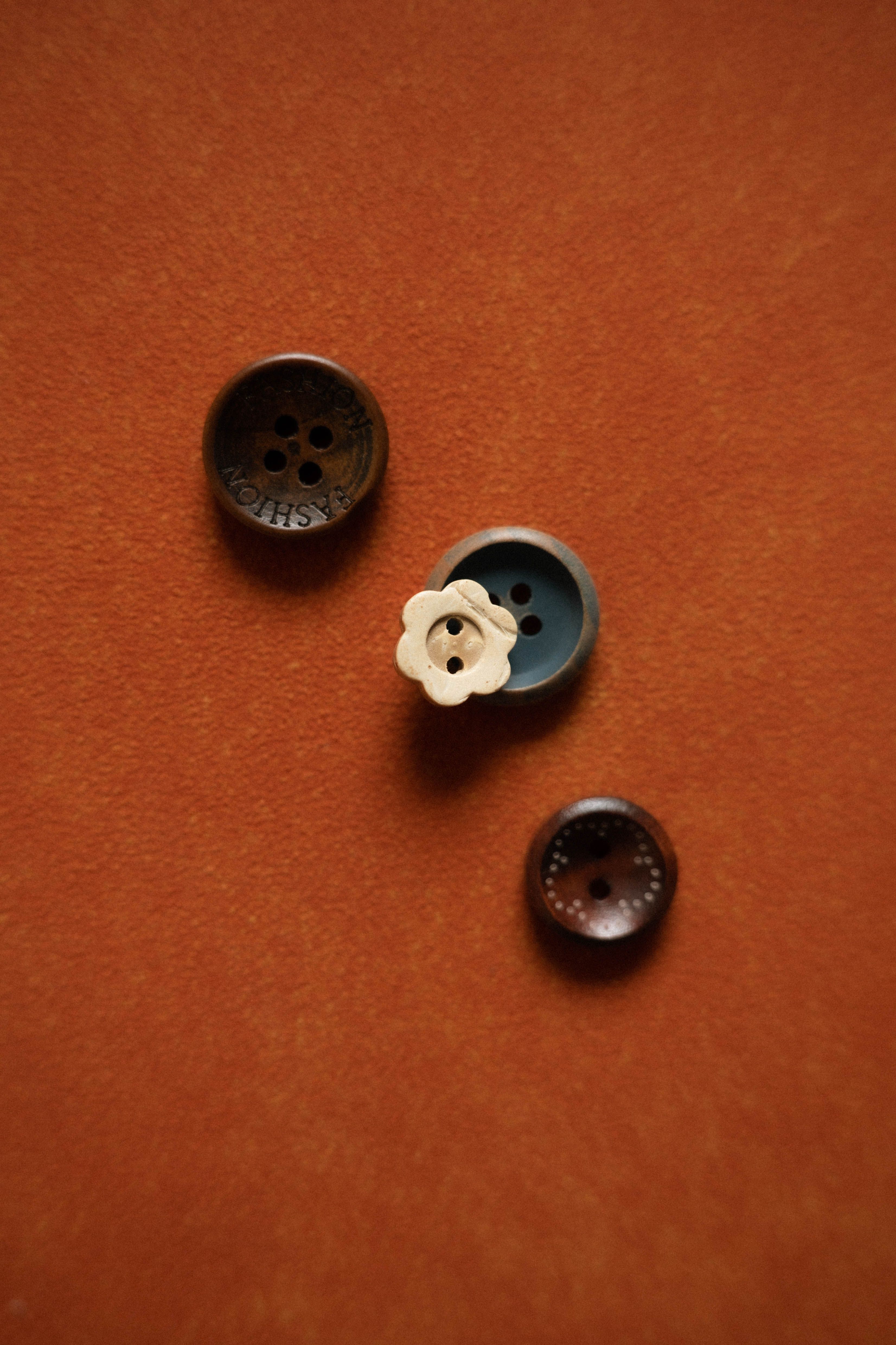 Buttons and garment components arranged for inspection